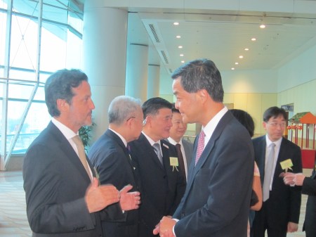 With Leung Chun-ying, Hong Kong prime minister.